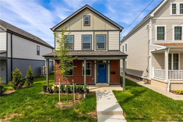 22 Mayflower St, Lincoln-Larimer, PA 15206 - view of front of property featuring a porch, board and batten siding, and a front yard