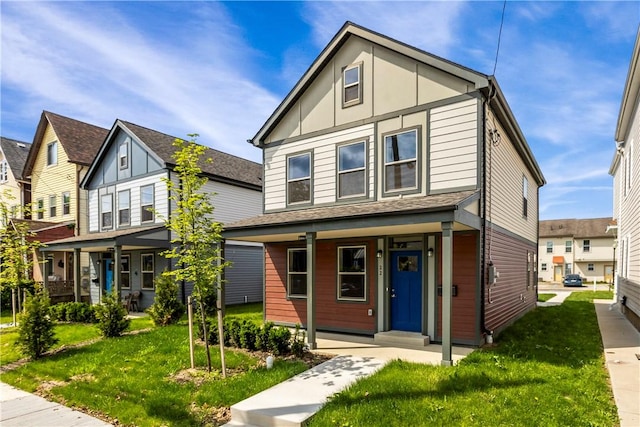 22 Mayflower St, Lincoln-Larimer, PA 15206 - view of front facade featuring covered porch and a front lawn