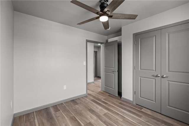 22 Mayflower St, Lincoln-Larimer, PA 15206 - unfurnished bedroom featuring baseboards, light wood-style flooring, a closet, and ceiling fan