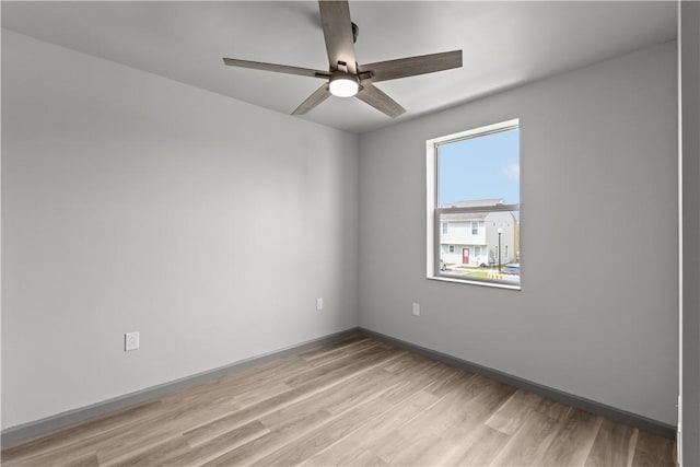 22 Mayflower St, Lincoln-Larimer, PA 15206 - empty room featuring light wood-style floors, a ceiling fan, and baseboards