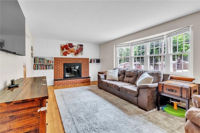 669 Carnival Dr, Plum Boro, PA 15239 - living area featuring a fireplace and wood finished floors