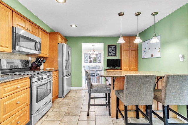 669 Carnival Dr, Plum Boro, PA 15239 - kitchen with appliances with stainless steel finishes, a chandelier, decorative backsplash, decorative light fixtures, and light stone countertops