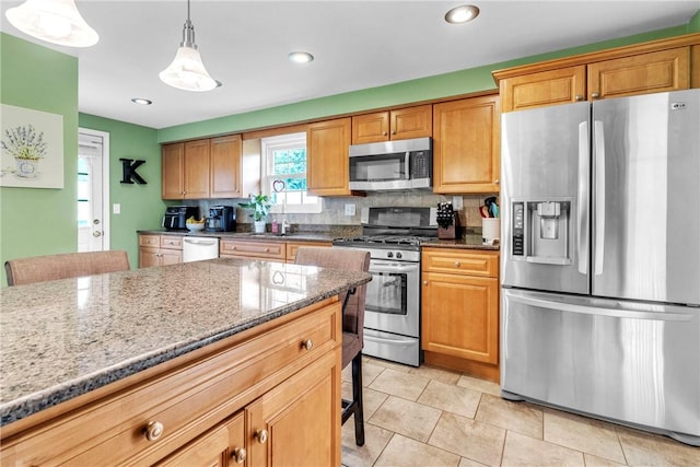 669 Carnival Dr, Plum Boro, PA 15239 - kitchen with stainless steel appliances, backsplash, stone counters, decorative light fixtures, and recessed lighting