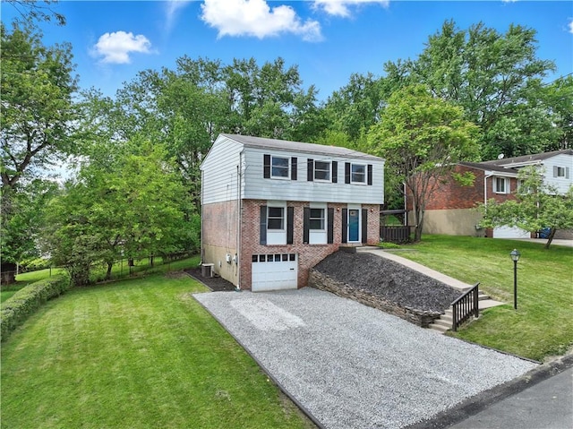 105 Canaveral Dr, Penn Hills, PA 15235 - view of front of house with driveway, brick siding, a garage, and central AC