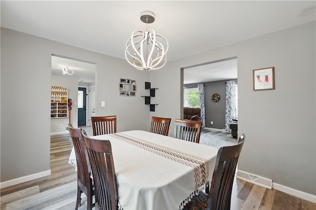 105 Canaveral Dr, Penn Hills, PA 15235 - dining room with a chandelier, light wood-type flooring, and baseboards