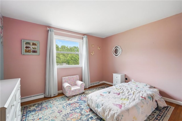 105 Canaveral Dr, Penn Hills, PA 15235 - bedroom with a baseboard radiator, light wood-style flooring, and baseboards