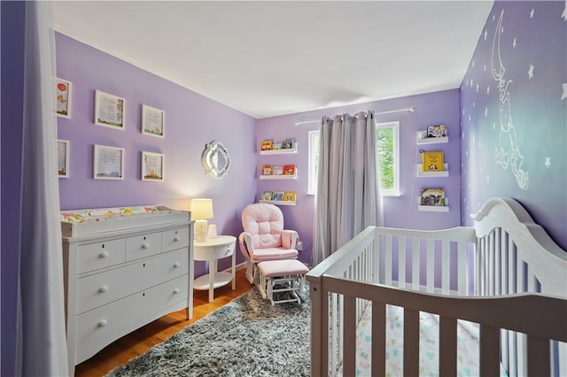 105 Canaveral Dr, Penn Hills, PA 15235 - bedroom featuring a crib and wood finished floors