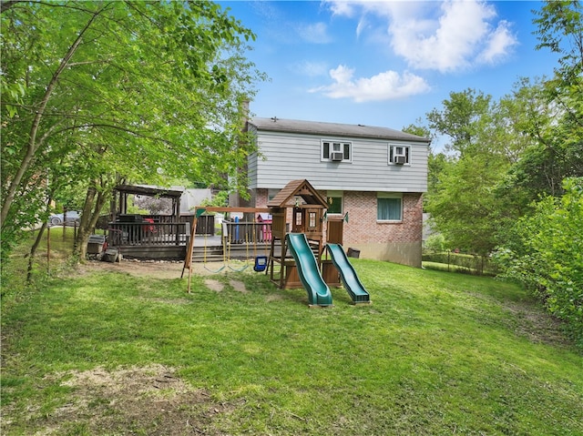 105 Canaveral Dr, Penn Hills, PA 15235 - back of house with brick siding and a playground