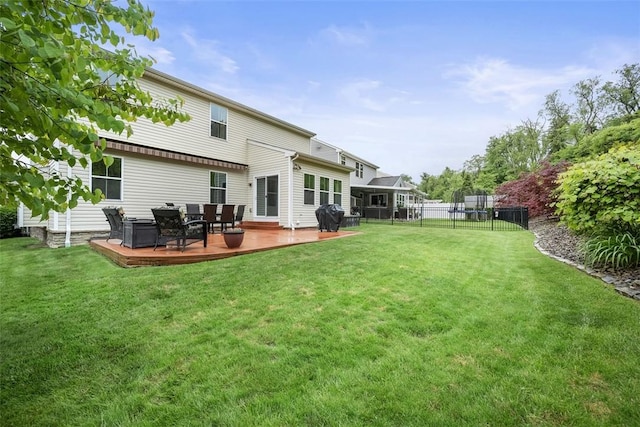 224 Long Ridge Dr, Kennedy Twp, PA 15108 - rear view of property with a wooden deck and a trampoline