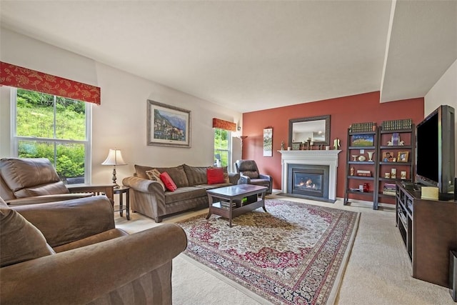 224 Long Ridge Dr, Kennedy Twp, PA 15108 - living room with a warm lit fireplace and light colored carpet