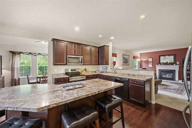 224 Long Ridge Dr, Kennedy Twp, PA 15108 - kitchen featuring stainless steel appliances, a peninsula, a sink, dark wood-type flooring, and open floor plan