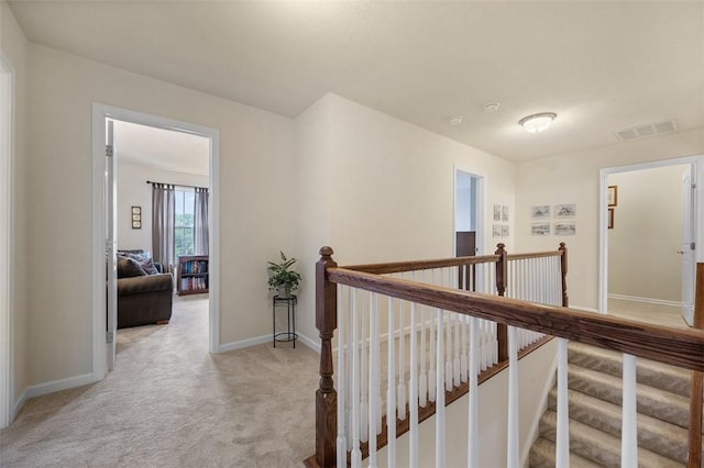 224 Long Ridge Dr, Kennedy Twp, PA 15108 - hall with an upstairs landing, light carpet, and baseboards