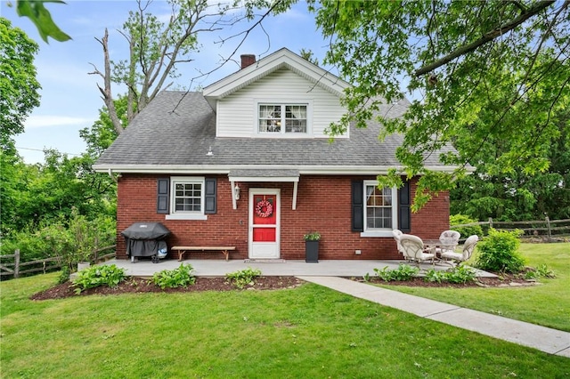 8243 High St, Mccandless, PA 15237 - view of front of home with brick siding, a shingled roof, a patio, and a chimney