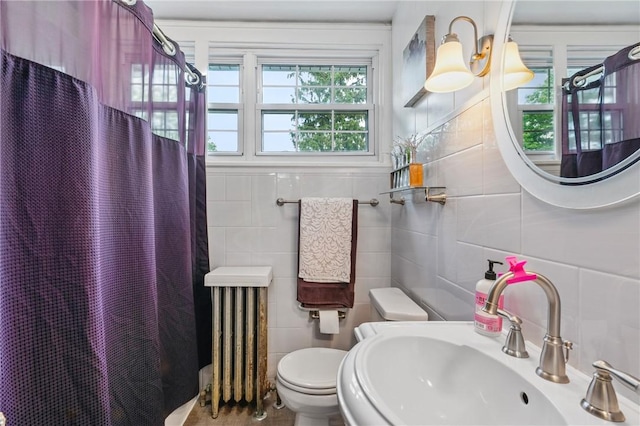 8243 High St, Mccandless, PA 15237 - full bathroom featuring a sink, radiator heating unit, toilet, tile walls, and curtained shower