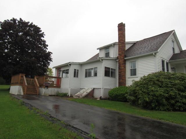 619 W Race St, Somerset Boro, PA 15501 - view of home's exterior with a wooden deck and a chimney