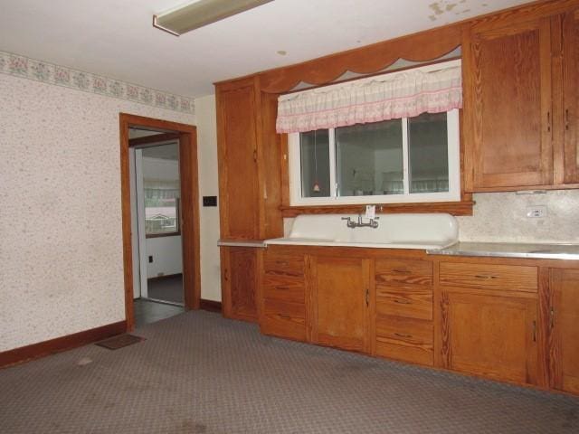 619 W Race St, Somerset Boro, PA 15501 - kitchen featuring carpet, brown cabinetry, wallpapered walls, and light countertops
