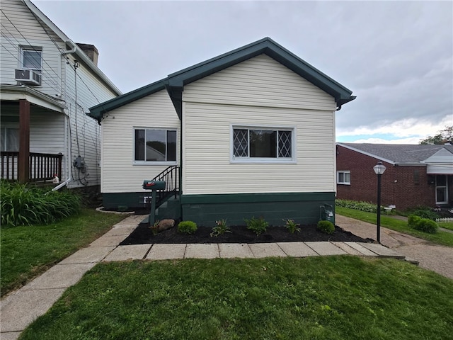 1102 Vermont Ave, White Oak, PA 15131 - view of front of home featuring a front yard and cooling unit