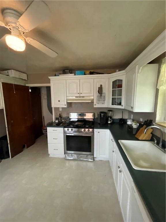 1001 Wible Run Rd, Shaler, PA 15209 - kitchen featuring gas range, a sink, under cabinet range hood, white cabinetry, and dark countertops