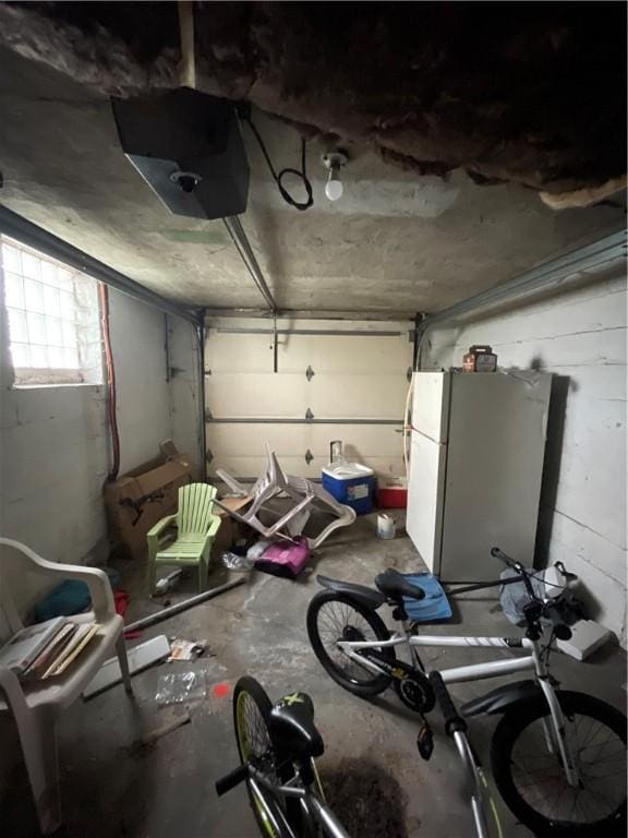 1001 Wible Run Rd, Shaler, PA 15209 - garage with freestanding refrigerator and a garage door opener
