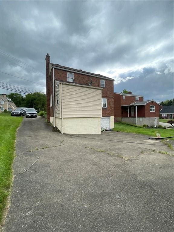 1001 Wible Run Rd, Shaler, PA 15209 - view of home's exterior with brick siding and a chimney