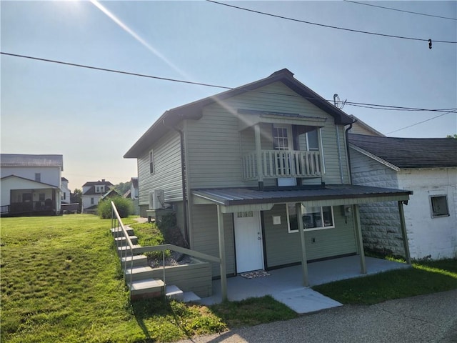 336 Fruit St, Waynsbrg/Frankln Twp, PA 15370 - view of front of property featuring a balcony, a front yard, and a patio