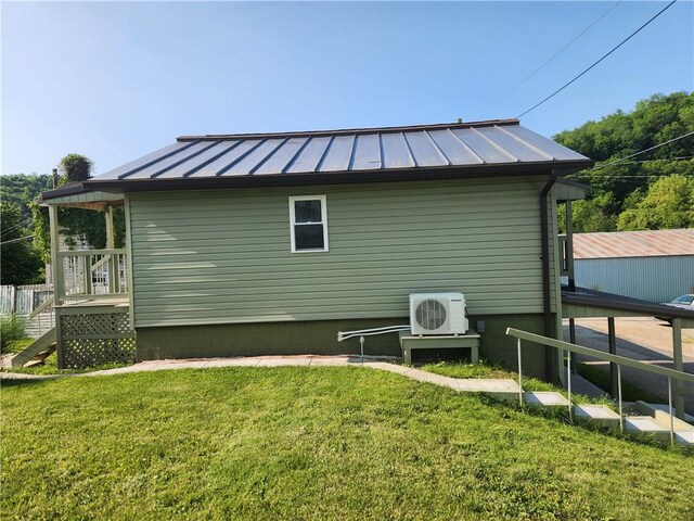 336 Fruit St, Waynsbrg/Frankln Twp, PA 15370 - view of property exterior with a yard, a standing seam roof, a cooling unit, and metal roof