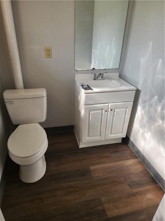 336 Fruit St, Waynsbrg/Frankln Twp, PA 15370 - half bath with baseboards, toilet, vanity, and wood finished floors