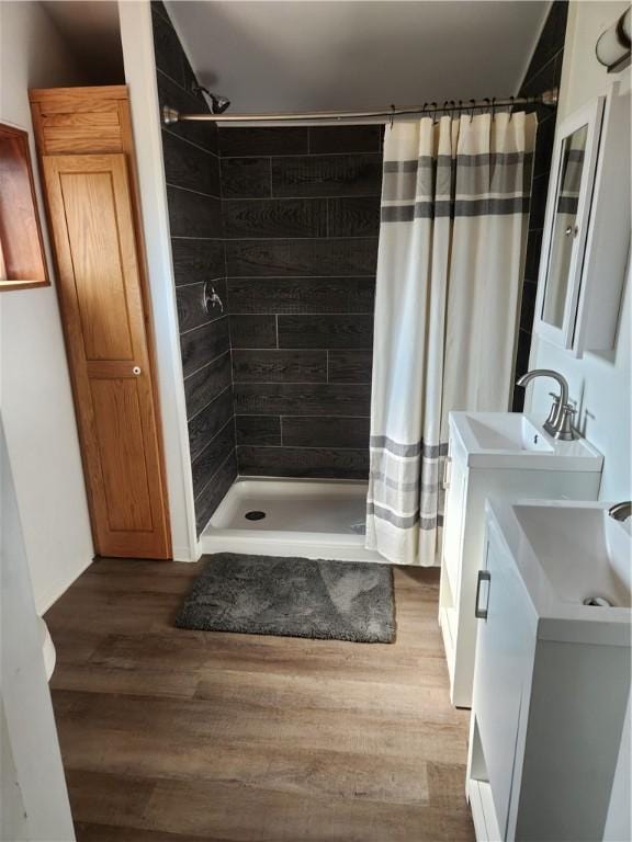 336 Fruit St, Waynsbrg/Frankln Twp, PA 15370 - bathroom featuring a stall shower, vanity, and wood finished floors