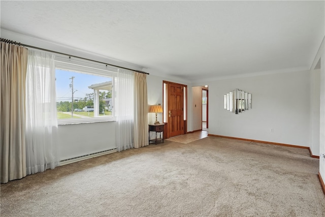 10539 Roseway Blvd, North Huntingdon, PA 15642 - empty room with a baseboard heating unit, carpet flooring, and baseboards