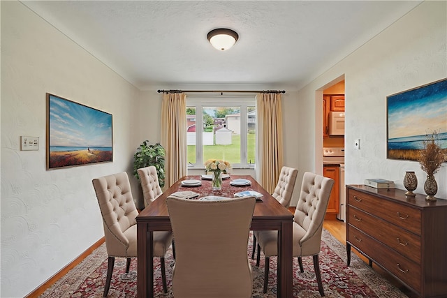 10539 Roseway Blvd, North Huntingdon, PA 15642 - dining room featuring wood finished floors and baseboards