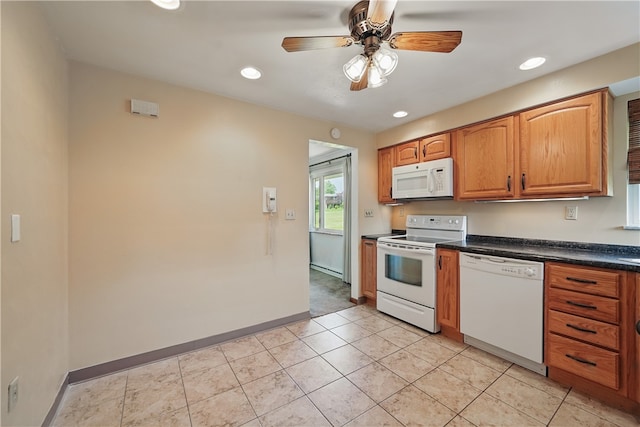 10539 Roseway Blvd, North Huntingdon, PA 15642 - kitchen featuring white appliances, dark countertops, a ceiling fan, recessed lighting, and baseboards