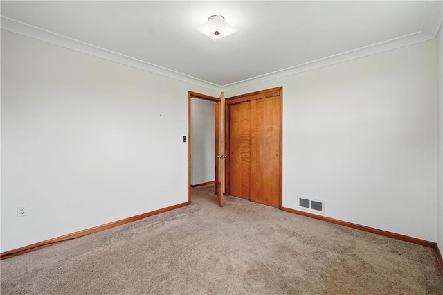 10539 Roseway Blvd, North Huntingdon, PA 15642 - carpeted empty room featuring baseboards and ornamental molding