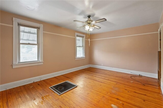 99 River Ave, Natrona, PA 15065 - empty room featuring plenty of natural light, ceiling fan, and wood-type flooring