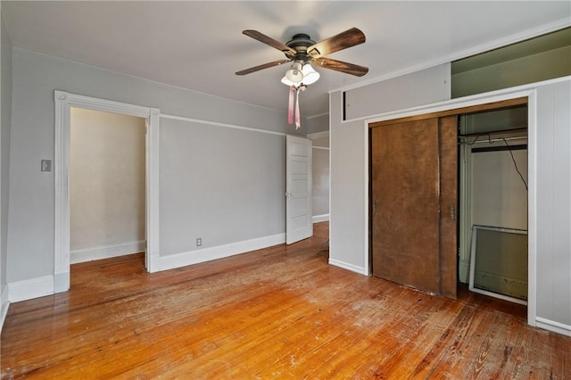 99 River Ave, Natrona, PA 15065 - unfurnished bedroom with hardwood / wood-style flooring, a closet, and a ceiling fan
