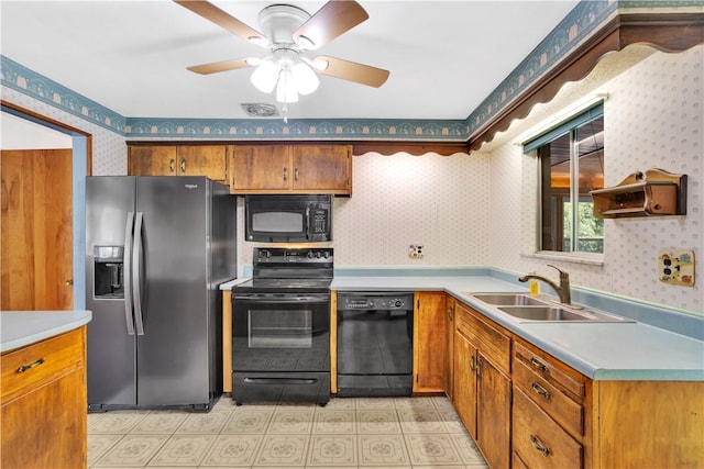 3410 E Stag Dr, West Deer, PA 15044 - kitchen featuring black appliances, wallpapered walls, a sink, brown cabinets, and light countertops