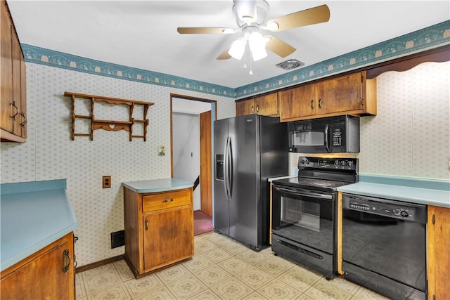 3410 E Stag Dr, West Deer, PA 15044 - kitchen featuring black appliances, ceiling fan, brown cabinetry, light countertops, and wallpapered walls