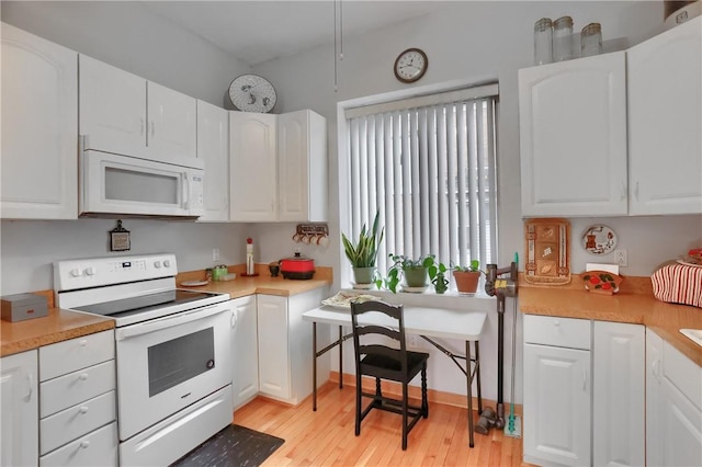 226-228 S Washington St Unit 226, City Of But Se, PA 16001 - kitchen with white appliances, light wood-type flooring, white cabinetry, and light countertops