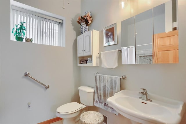 226-228 S Washington St Unit 226, City Of But Se, PA 16001 - bathroom featuring a sink, toilet, and a shower with shower curtain