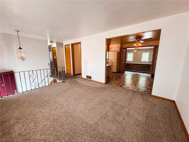 117 Harphen St, Versailles Boro, PA 15132 - unfurnished room with baseboards, carpet, and ceiling fan