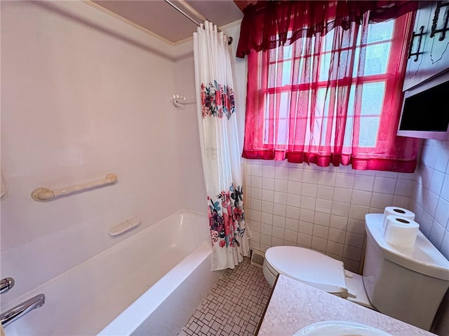 117 Harphen St, Versailles Boro, PA 15132 - bathroom with toilet, shower / bath combo with shower curtain, tile patterned flooring, vanity, and tile walls