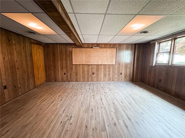 117 Harphen St, Versailles Boro, PA 15132 - empty room with wood finished floors, a paneled ceiling, and wooden walls