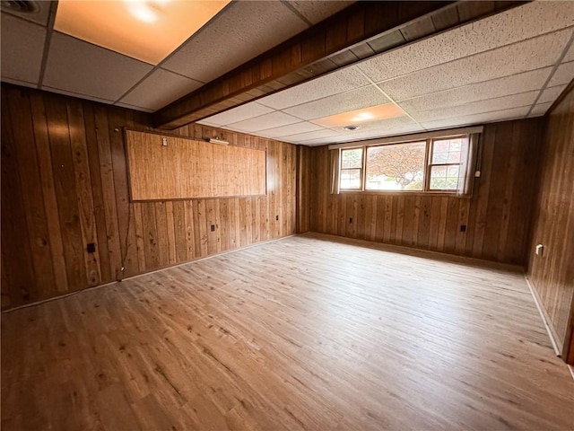 117 Harphen St, Versailles Boro, PA 15132 - spare room with wood finished floors, wood walls, and a drop ceiling