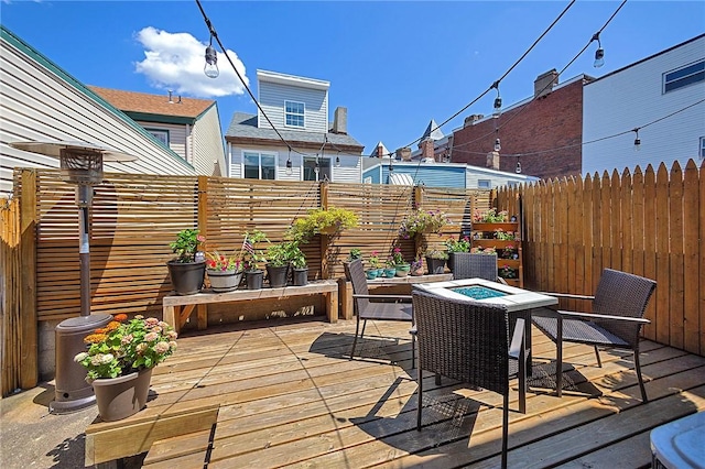 1921 Jane St, South Side, PA 15203 - wooden deck with an outdoor fire pit and a fenced backyard