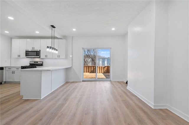 220 Dewey St, Edgewood, PA 15218 - kitchen featuring appliances with stainless steel finishes, light wood-style flooring, baseboards, light countertops, and recessed lighting