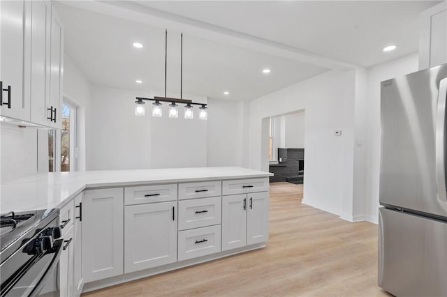 220 Dewey St, Edgewood, PA 15218 - kitchen featuring stainless steel appliances, a peninsula, light wood finished floors, white cabinets, and recessed lighting