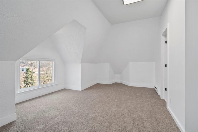 220 Dewey St, Edgewood, PA 15218 - additional living space with carpet, baseboards, lofted ceiling, and baseboard heating