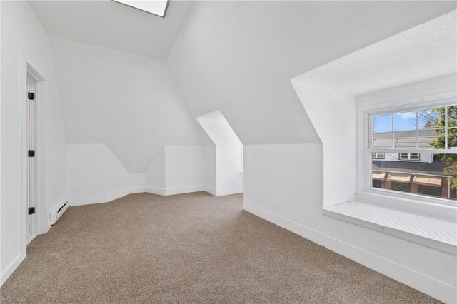 220 Dewey St, Edgewood, PA 15218 - bonus room with carpet, lofted ceiling, a baseboard heating unit, and baseboards
