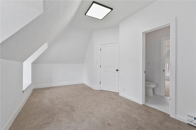 220 Dewey St, Edgewood, PA 15218 - additional living space featuring carpet, vaulted ceiling, a baseboard heating unit, and baseboards