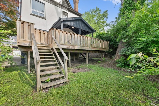 220 Dewey St, Edgewood, PA 15218 - back of house featuring stairs, stucco siding, a wooden deck, and a lawn