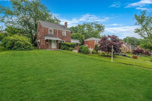 142 Slater Dr, Pleasant Hills, PA 15236 - view of front facade with a chimney and a front yard